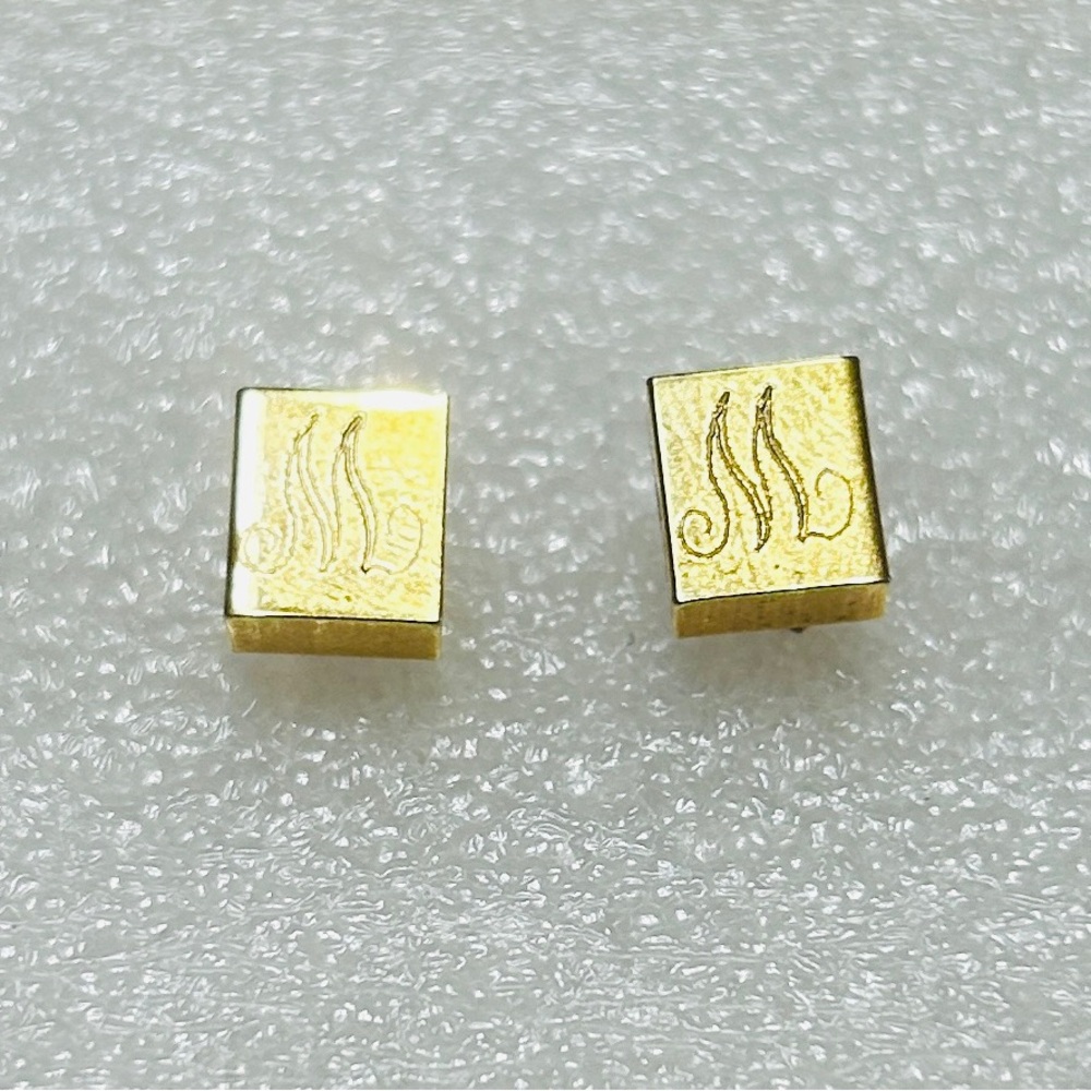 Earrings, M on front of each, goldtone. Backs have N/C stamped on them.